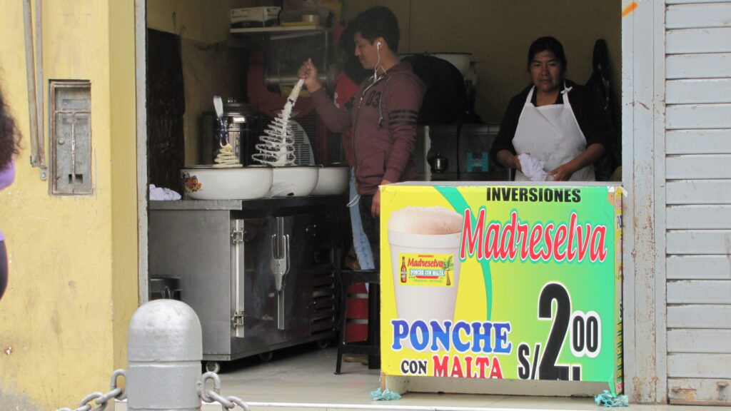 woman and man making ponche in Lima Peru