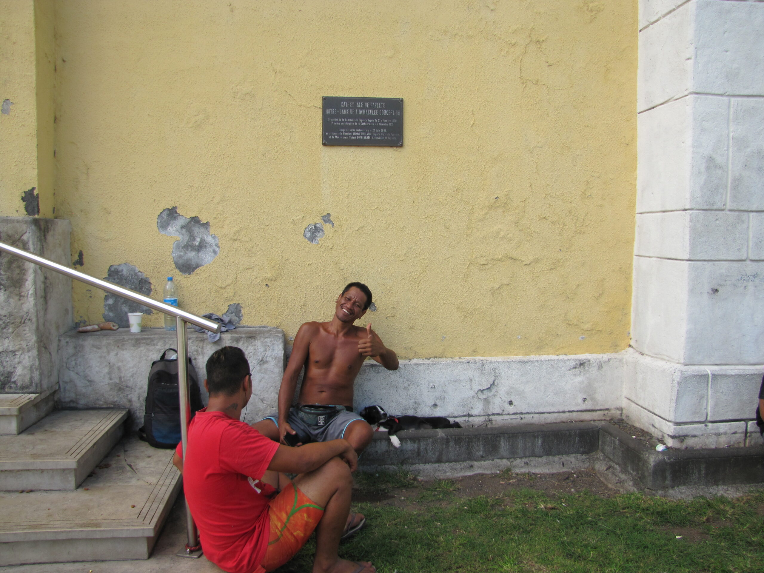 Street guy with dogs in Tahiti