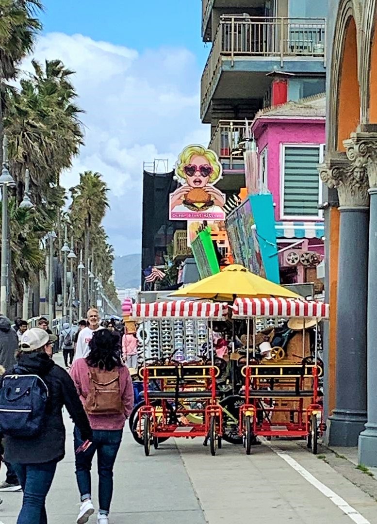 Blonde eating a hamburger sign