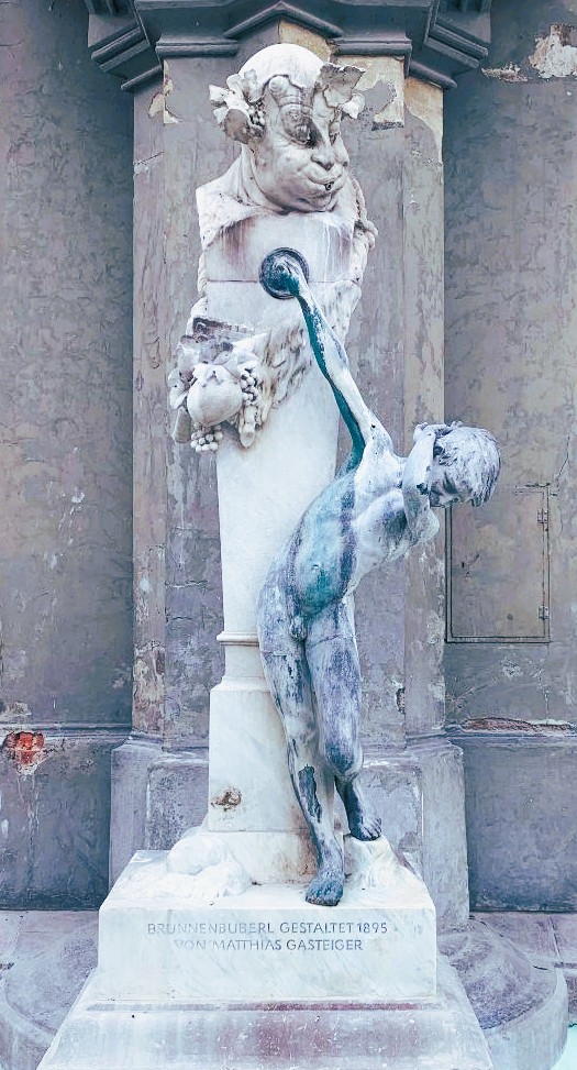 boy and bacchus fountain in Munich